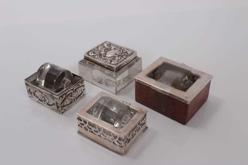 Lot 176 - Edwardian silver mounted glass stamp box and three silver mounted glass stamp water rollers (4)