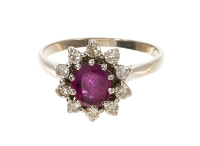 Lot 426 - Ruby and diamond cluster ring