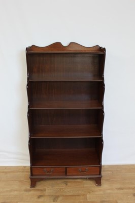 Lot 19 - Mahogany waterfall bookcase with two drawers below, 76cm wide, 38.5cm deep, 152cm high