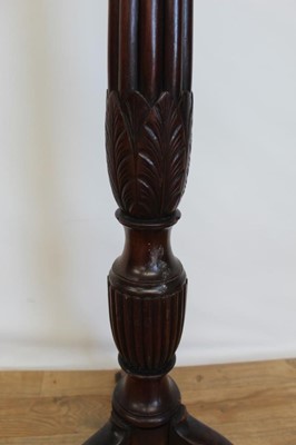 Lot 20 - Late Victorian mahogany torchere with hexagonal top on reeded column and three hipped splayed legs, 134cm high