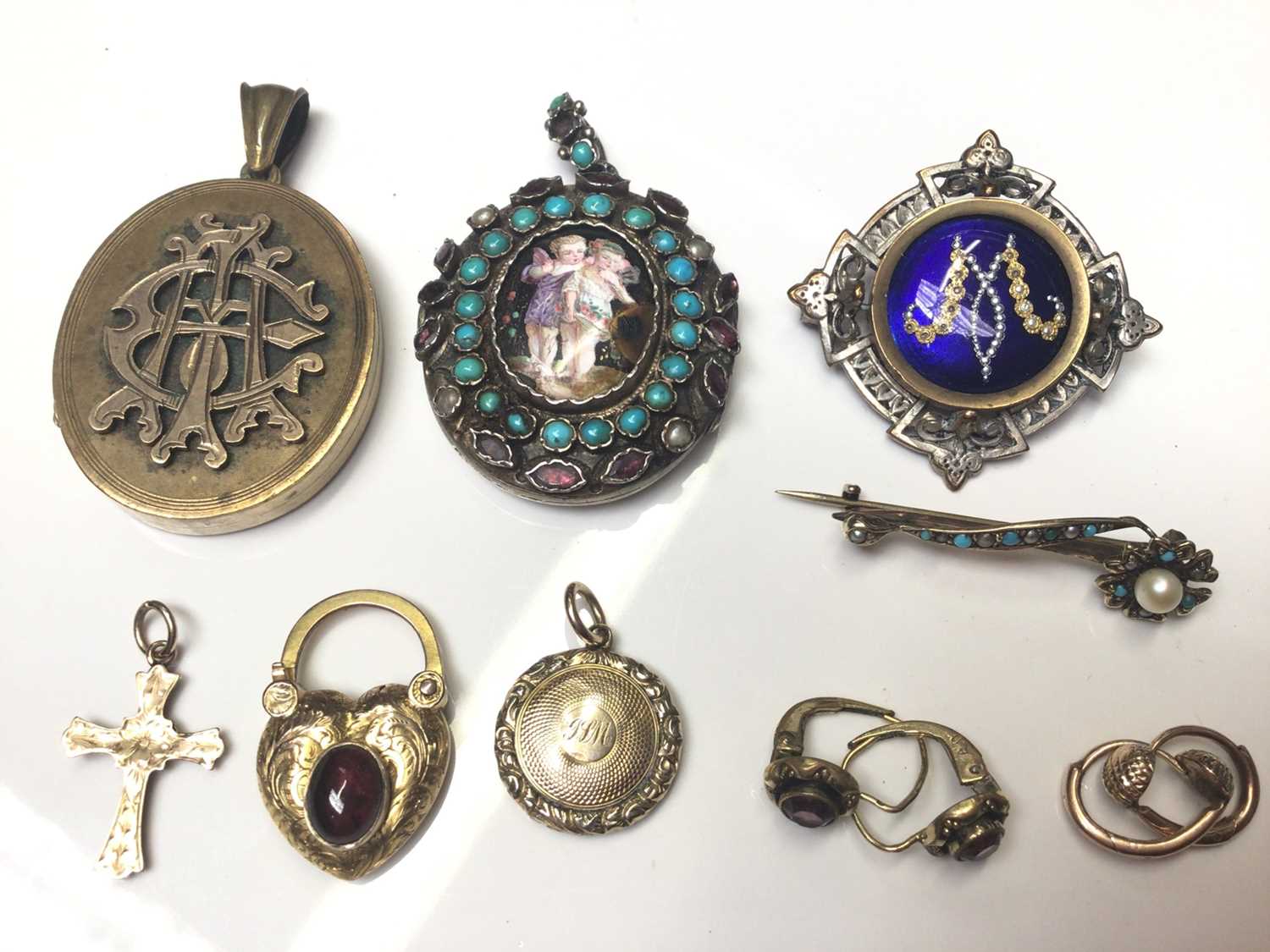 Lot 12 - Group of antique and later locket pendants, brooches and two pairs of earrings