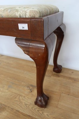 Lot 34 - Mahogany framed stool with drop in seat on cabriole legs with claw and ball feet, 79cm wide, 40cm deep, 50cm high, together with an oak refectory style coffee table (2)