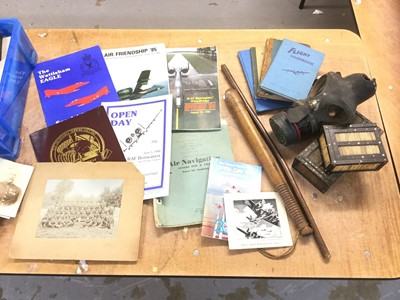 Lot 737 - Collection of mixed militaria to include military photographic postcards, RAF base open day programmes, staybrite buttons and badges, truncheon and other items (1 box).