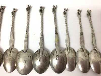 Lot 113 - Eleven Continental silver coffee spoons with figure decoration