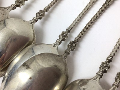 Lot 115 - Eleven silver (800) teaspoons with hoof terminals and gilt bowls
