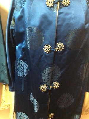 Lot 2096 - Vintage Chinese blue silk brocade jacket by Dolls House size small, two Chinese silk hostess dresses with manderine collars and a reversable silk brocade coat with fabric fastenings. Plus an Ottoma...