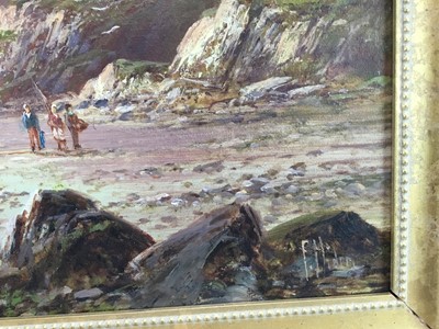 Lot 5 - Frank Hider (1861 - 1933) oil on canvas-  A seascape with fisherfolk and a moored vessel near cliffs, signed, 49cm x 29cm framed