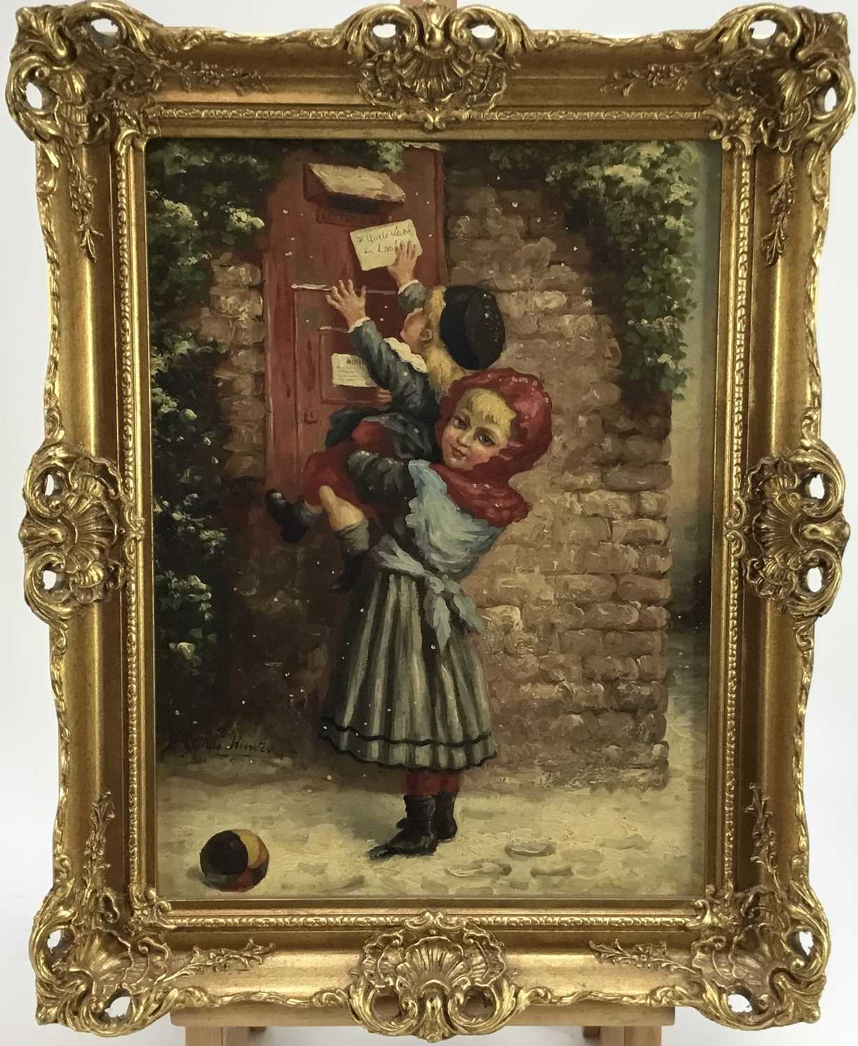 Lot 25 - Charles Hunter, mid 20th Century, oil on canvas - children posting a letter to Uncle Jack, signed, 39cm x 29cm, framed.