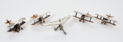 Lot 219 - Four white metal and bronze model vintage aeroplanes and one other marked 800