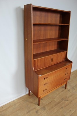 Lot 71 - Mid 20th century teak bookcase with adjustable shelves above, stationary compartment enclosed by tambour shutter and three drawers below, 100.5cm wide, 42.5cm deep, 182cm high