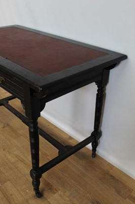 Lot 72 - Late Victorian ebonised writing table inset lined top, two drawers below on turned legs joined by stretchers, 106cm wide, 57cm deep, 76cm high
