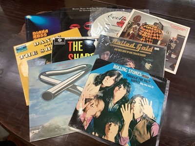 Lot 2251 - Four boxes of LP records and singles to include Buddy Holly, The Beach Boys, Elvis and others.