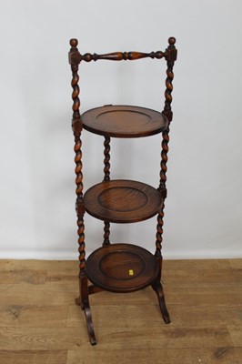 Lot 93 - Oak three tier folding cake stand with spiral twist supports, 97cm high