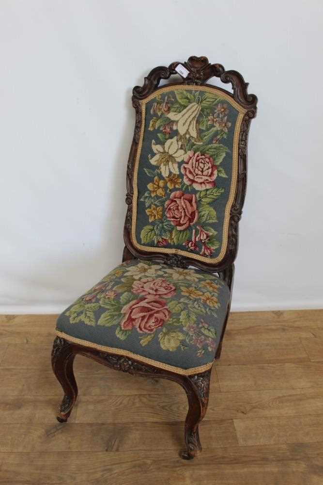 Lot 108 - Victorian nursing chair with floral tapestry seat and back on carved cabriole legs, 89cm high