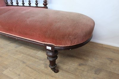 Lot 110 - Victorian mahogany framed chaise langue with pink upholstery on turned legs and castors, 194cm wide approx, 74cm high