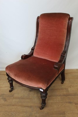 Lot 111 - Victorian mahogany framed gentleman's chair with pink upholstery, together with a matching ladies chair (2)