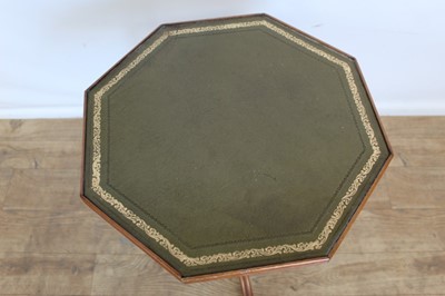 Lot 120 - Yew wood finished wine table with octagonal leather lined top on pedestal base, 41cm wide, 50cm high