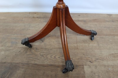 Lot 120 - Yew wood finished wine table with octagonal leather lined top on pedestal base, 41cm wide, 50cm high