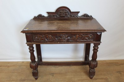 Lot 123 - Late Victorian carved oak hall table with raised ledge back and single drawer below with lion mask handle, 90cm wide, 45cm deep, 92cm high