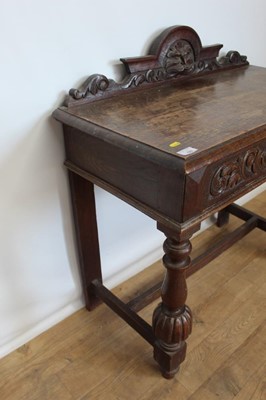 Lot 123 - Late Victorian carved oak hall table with raised ledge back and single drawer below with lion mask handle, 90cm wide, 45cm deep, 92cm high