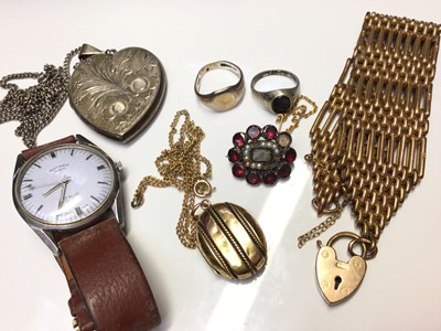 Lot 58 - Georgian garnet and seed pearl brooch, Victorian yellow metal oval locket on chain, Edwardian gilt metal gate bracelet and costume jewellery