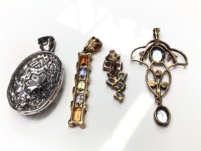 Lot 72 - 9ct white gold diamond set pierced oval panel pendant, Edwardian style 9ct gold open work pendant and two 9ct gold multi-coloured gem set pendants (4)
