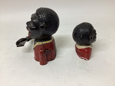 Lot 2421 - Early 20th century cast iron mechanical novelty money box/bank in the form of a gentleman in a red jacket with white collar, moveable arm, tongue and eyes, base plate missing, 17cm overall height,...