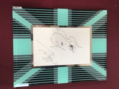 Lot 1418 - Autographed doodle by Twiggy, together with a British Airways menu signed by Bob Hoskins