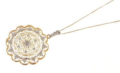 Lot 497 - Edwardian style diamond pendant with a pierced 18ct yellow gold scalloped openwork plaque diamond-set floral decoration, on a gold trace chain