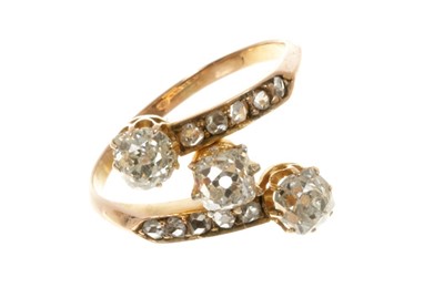 Lot 498 - Victorian diamond three stone ring with three cushion shaped old cut diamonds in a cross-over setting with rose cut diamond shoulders on 18ct yellow gold shank. Estimated total diamond weight appro...