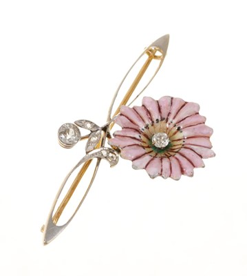 Lot 724 - Edwardian Art Nouveau diamond and enamel brooch with a pink enamel daisy flower centred with a diamond on a whiplash scroll with diamond floral bud in platinum setting on 18ct yellow gold.