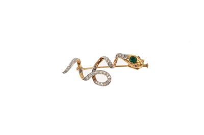 Lot 811 - Victorian style emerald and diamond snake brooch, the engraved gold snake's head with ruby eyes and a cushion cut emerald, the coiled gold body with old cut diamonds.