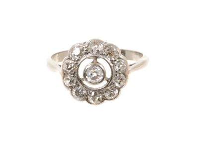 Lot 522 - Edwardian diamond cluster ring with a daisy flower head cluster of old cut diamonds with openwork diamond border in platinum setting on 18ct white gold shank.