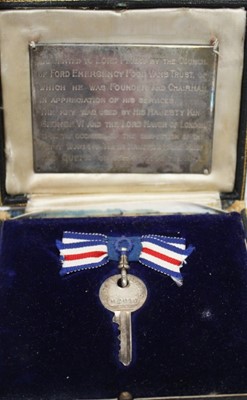 Lot 2018 - Royal Interest- door key in velvet lined presentation box, with silver plaque to interior engraved- 'Presented to Lord Perry by the Council of Ford Emergency Food Vans trust of which he was Founder...