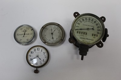 Lot 2023 - Vintage Dodge Brothers speedometer and mileage gauge together with two barometers and a clock, possibly for car interior usage (4)