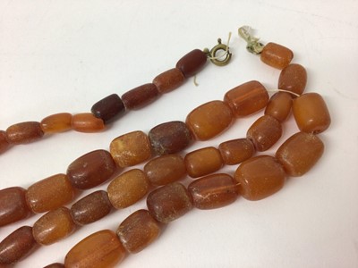 Lot 105 - Two amber bead necklaces, 56cm and 77cm long