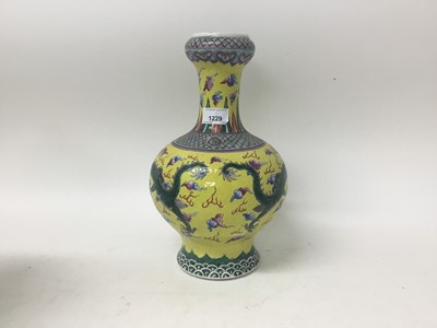 Lot 1229 - Chinese yellow and polychrome garlic neck vase with stand