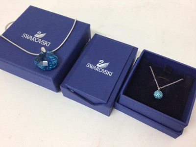 Lot 112 - Swarovski crystal pendant necklaces and swan brooch, all boxed