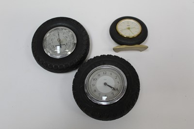 Lot 2031 - Goodyear tyres advertising / promotional desk aneroid barometer in the form of a tyre, together with two similar clocks (3)