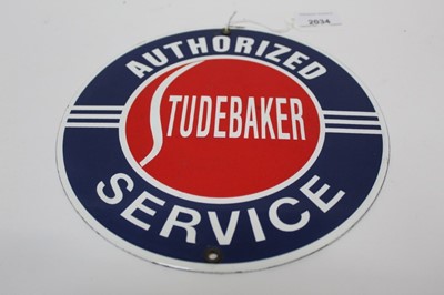 Lot 582 - Reproduction circular Studebaker Authorized Service enamel sign, 21.5cm in diameter.