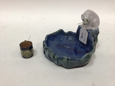 Lot 1128 - Doulton Lambeth model of a polar bear next to water, together with other stoneware items and three glass decanters (9)