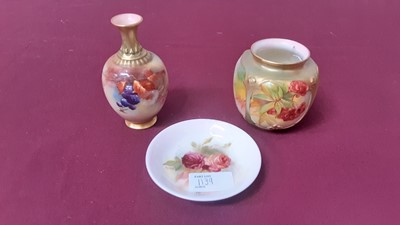 Lot 1139 - Three pieces of Royal Worcester - small dish with hand painted rose decoration, signed K Blake, 10cm diameter, vase with berry and leaf decoration, 11cm high and  another with berry decoration, 8cm...