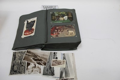 Lot 1430 - Postcards in an album and a box including Children's, fairies, comic, topography, greetings, social history, real photograhic etc.  Plus a box of later postcards and a box of photographs and two sm...