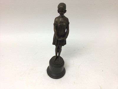 Lot 2456 - After Demetre Chiparus (1886-1947), bronzed figure of a woman standing on a stone base, signed, 34.5cm high