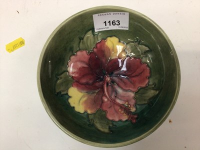 Lot 1163 - Moorcroft pottery bowl decorated in the Hibiscus pattern on green ground, impressed marks to base, 13.5cm diameter