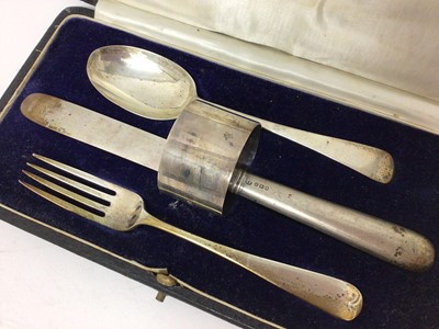 Lot 191 - Silver knife, fork, spoon and napkin ring set in fitted case