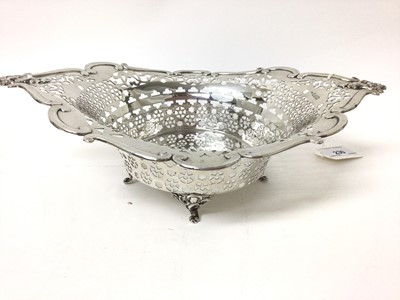 Lot 230 - Edwardian silver pierced bowl with moulded mask handles on four scrolled feet