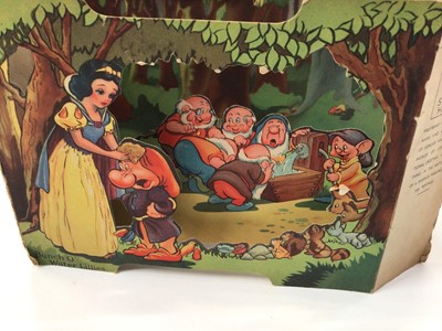 Lot 1424 - 1930s Greetings cards in two albums plus loose including 1938 Disney Snow White stand up diorama by Valentines, Mickey Mouse x2, children's novelty cards, earlier paper lace cards, Southampton fol...