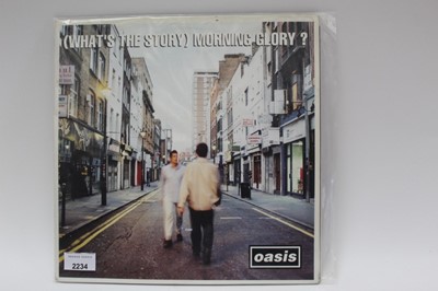 Lot 2234 - Three vinyl records by Oasis