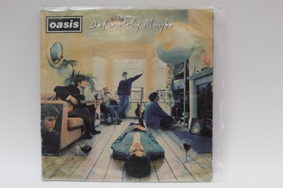 Lot 2234 - Three vinyl records by Oasis